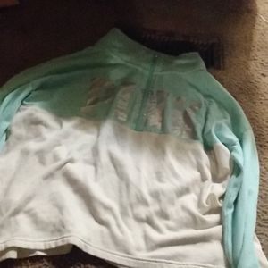 A mint green and white pink sweater